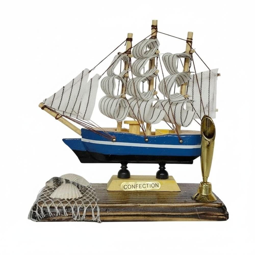 wooden sailboat souvenir with shell accents